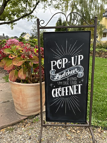 Kundenstopper für einen Pop-Up Store